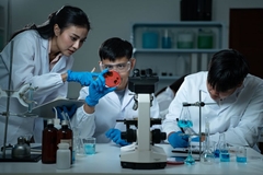 Image Researchers analyzing bacteria