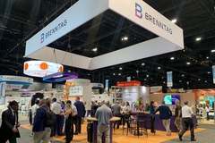Image trade show booth with people walking around