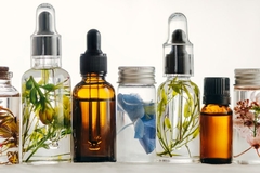 Image bottles of essential oils with botaicals