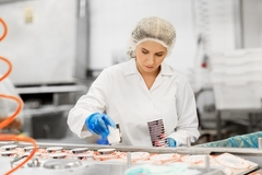 Image a female worker in an ice cream factory