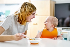 Image Mother and baby smiling during eating