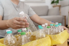 Image putting plastic bottle in bin