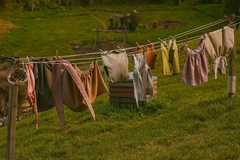 Image colorful laundry hanging on line in field