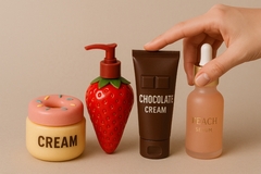 Image A hand reaching for food-inspired beauty products.