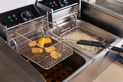 Image frying chicken nuggets in oil