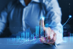 Image A man clicks on a bar in a virtual graph to better understand the financial information being reported.