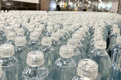 Image Rows of empty bottles in a factory
