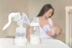 Image Mother breast feeding infant