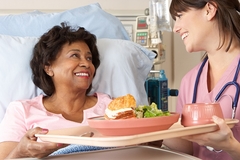 Image Female patient eating hospital food
