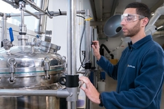man using factory machinery