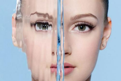 Image A girls face with water over one side distorting it.