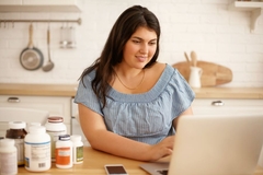 Overweight person checking social media for supplement