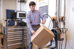Image Man holding carton box.