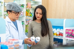 Man and woman looking at supplements