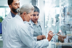 Researchers collaborating in lab