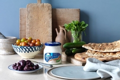 Image Food and glass jar with cream cheese on table.