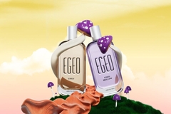 Two perfumes next to each other with mushrooms around them.