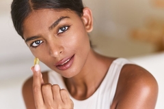 beautiful lady holds supplement