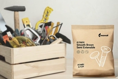 Image A bag of brown material next to a wooden crate full of tools