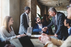 People in a business meeting shaking hands