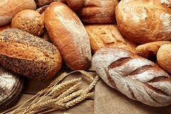 Image variety of baked breads on wooden background