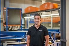A man smiling into the camera