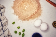 olive flour with eggs and olives on white background