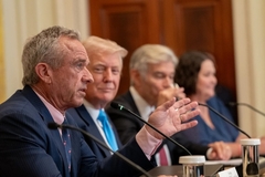 Image RFK jr. sits on a panel with President Donald Trump.