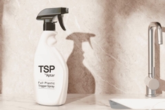 Image A spray bottle with a black handle