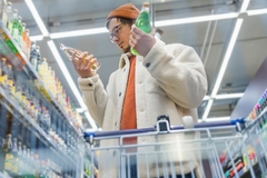 Image Man choosing between two beverages