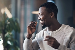 Image Man consuming supplements