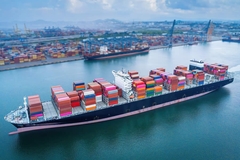 cargo containers on a ship sailing in the sea