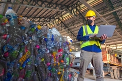 Image man with plastic bottle waste