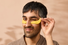 Image A man with an eye patch on his face in the shape of a banana.