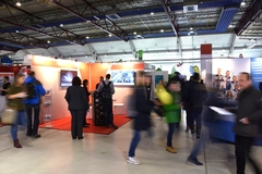 Image blurred image of trade show floor with people walking