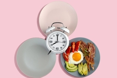 Image Clock next to plates of food