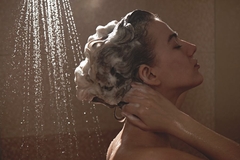Image woman washing her hair in the showed
