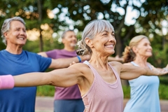 Healthy seniors doing yoga outside