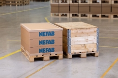 Image Wooden pallets with blue writing on them.