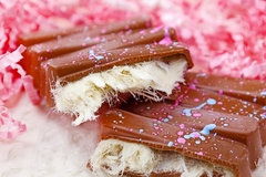 chocolate with white strands on a pink background