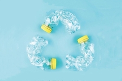 Image A recycling symbol made of plastic bottle.