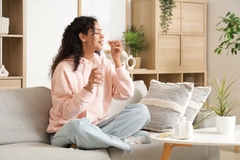 Woman taking capsule