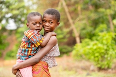 Image Child holding a toddler in Africa