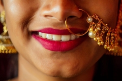 woman with traditional indian jewelry smiling