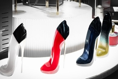 Image carolina herrera perfumes displayed on a shelf