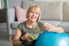 Image Senior woman eating a salad