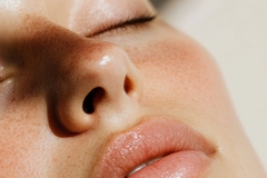 Image A girls face zoomed in with a glow on it.