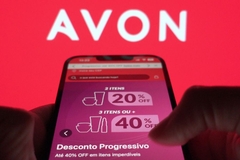 Image person holding cell phone open on Avon's app