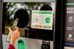 hand putting glass in deposit bank