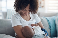 Image Woman breastfeeding infant